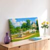 Painterly 1950s view of Story Land in Glen, New Hampshire, with a fairytale castle, white arched bridge, fountain, gardens and trees under a blue sky.