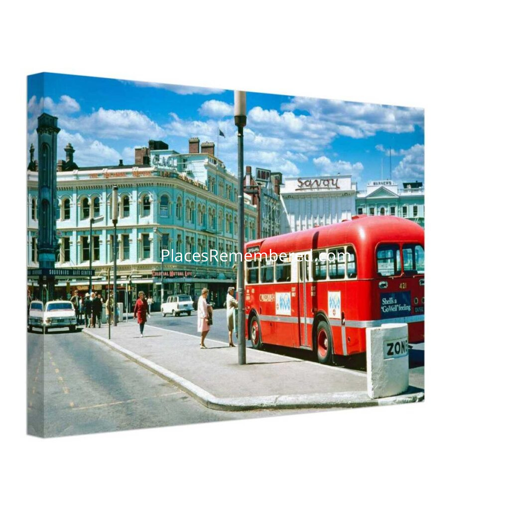 1970s view of Cathedral Square in Christchurch, New Zealand, featuring a bright red Christchurch Transport bus, the Colonial Mutual Life Building and the Savoy, from a genuine vintage color photograph.