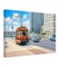Painterly 1980s view of the Detroit Citizens Railway trolley on Jefferson Avenue, heading toward the Renaissance Center with downtown buildings, traffic and period cars.