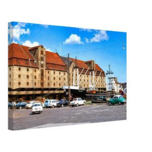 Historic Greenland Trade Warehouse on Copenhagen Harbor with the cargo ship Bakkafoss, Denmark 1968.