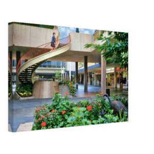 1960s view of Lloyd Center shopping mall in Portland, Oregon, featuring the iconic spiral staircase and landscaped courtyard, reimagined in a painterly style from a genuine vintage color photograph.