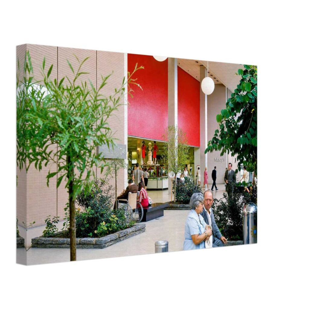 1960s interior of Macy's at Walt Whitman Mall in South Huntington, New York, featuring landscaped gardens and modern mall architecture, reimagined in a painterly style from a genuine vintage color photograph.