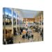 Midtown Plaza, Rochester, New York 1960s - Canvas Print 1960s interior of Midtown Plaza in Rochester, New York, featuring the famous Clock of Nations, reimagined in a painterly style from a genuine vintage color photograph.