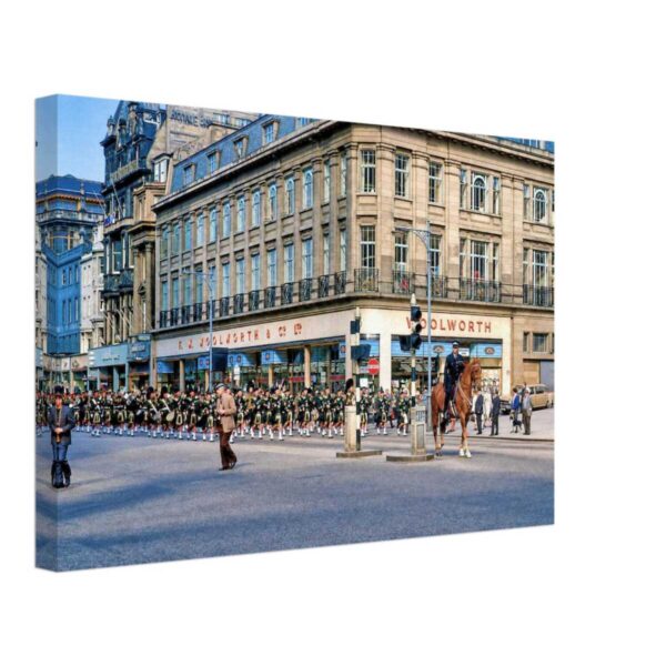 Pipe band parade passing the F.W. Woolworth store on Princes Street, Edinburgh, Scotland, 1966.