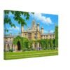 St John’s College, Oxford, England 1950s - Canvas Print Painterly 1950s view of St John’s College in Oxford, England, with ivy-covered historic college buildings, Gothic towers, lawns, flower beds and blue sky.