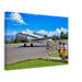 1960s painterly view of a Trans Australia Airways Douglas DC-3 at Mount Hagen Airport, Papua New Guinea with passengers boarding - canvas print.