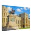 Painterly 1980s view of Windsor Castle with the equestrian statue of King Charles II, pale stone walls, Gothic windows and blue sky.